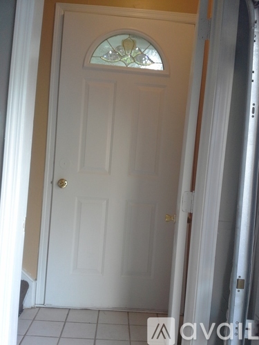 A white door with a glass window above it.