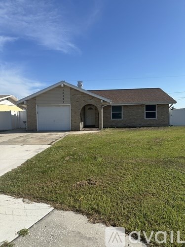 A house with a garage is available for sale.