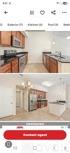 A kitchen with wooden cabinets and a stove top oven.