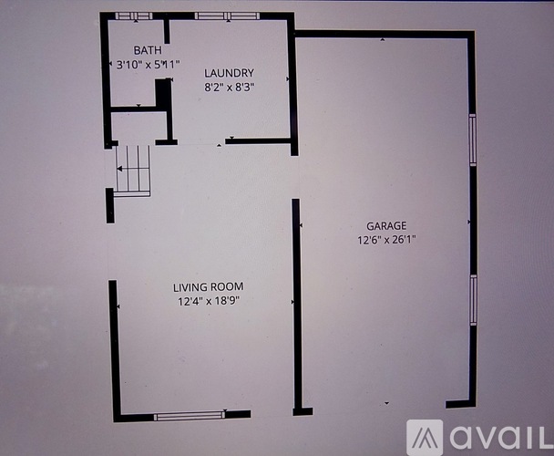 A floor plan of a house with a bath, laundry, garage and living room.