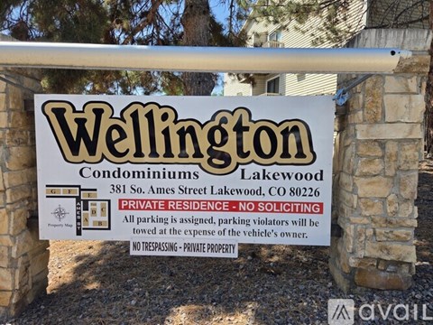 A sign for Wellington Condominiums in Lakewood, CO.