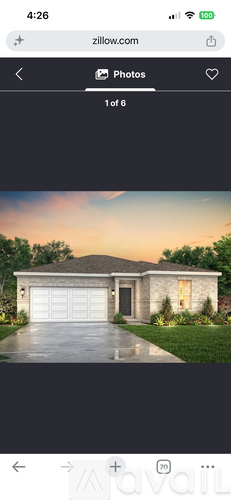 A house with a garage is shown in the image.