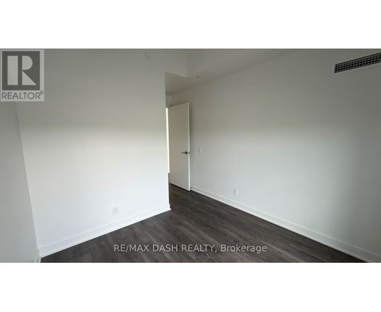 A room with a doorway leading to another room.