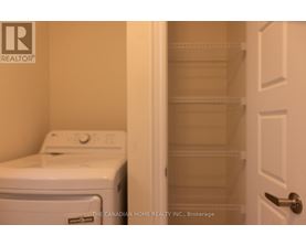 A white dryer and washer in a laundry room.