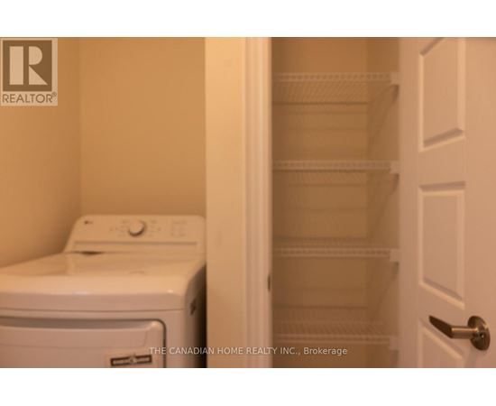 A white dryer and washer in a laundry room.