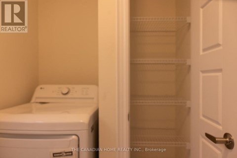 A white dryer and washer in a laundry room.
