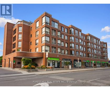 A multi-story building with a green awning and a sign that says "Appt." is for sale.