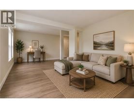 A living room with a couch, coffee table, and lamp.