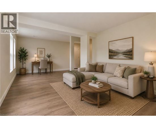 A living room with a couch, coffee table, and lamp.