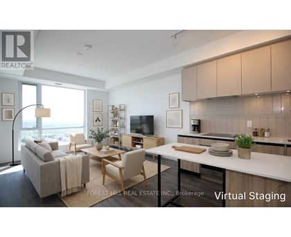 A modern living room with a grey couch, a wooden coffee table, and a large window.