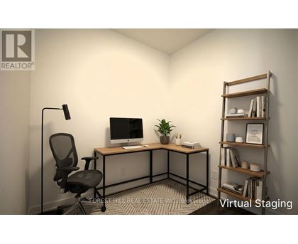 A well-lit office space with a desk, chair, and shelving unit.