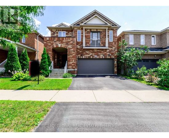 A large house with a brick facade and a garage door.