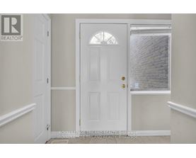 A white door with a glass window above it.
