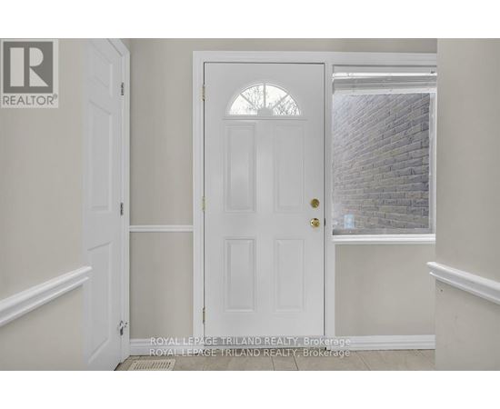 A white door with a glass window above it.