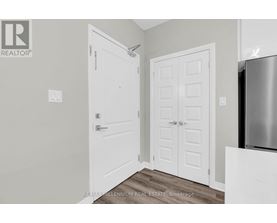A white door is on the left and a white door with a panel design is on the right.
