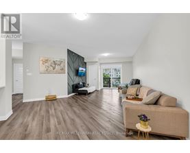 A spacious living room with a couch, a chair, and a coffee table.