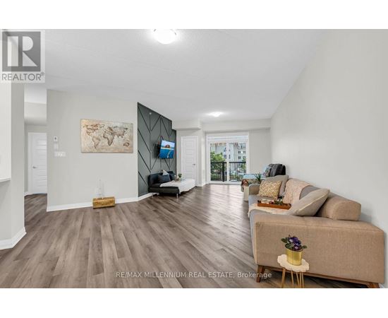 A spacious living room with a couch, a chair, and a coffee table.