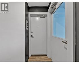 A white door with a number 2 on it.