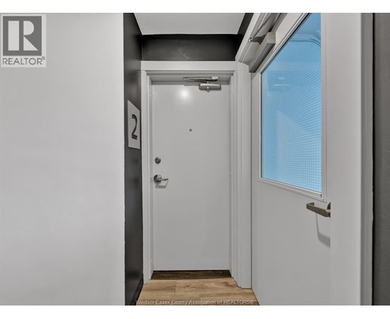 A white door with a number 2 on it.