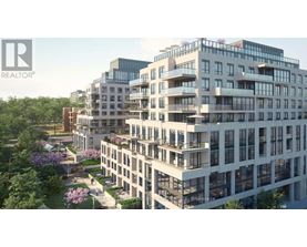 A modern apartment complex with multiple buildings and balconies.