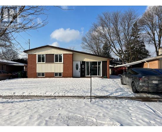 A house with a snow-covered ground in front.