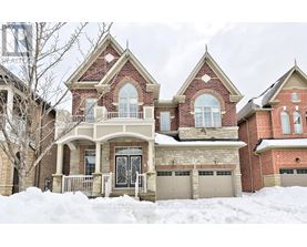 A large house with a snow-covered front yard.