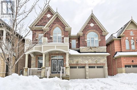 A large house with a snow-covered front yard.