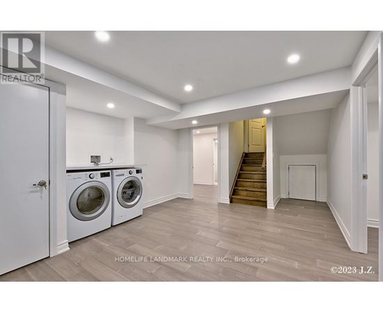 A laundry room with a washer and dryer in it.