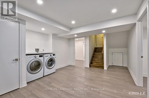 A laundry room with a washer and dryer in it.