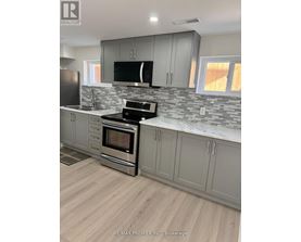 A kitchen with a stove top oven and a microwave.
