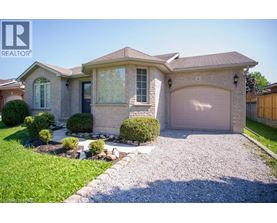 A house with a gravel driveway and a garage door.