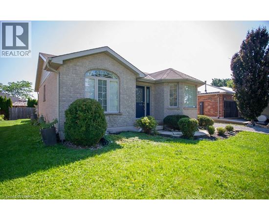 A house with a lawn in front of it.
