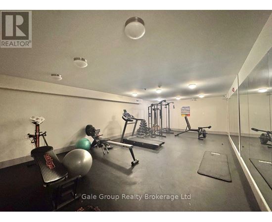 A gym with a variety of equipment including a bench press, a leg press, a squat rack, a treadmill, a rowing machine, a stationary bike, a medicine ball, and a yoga mat.