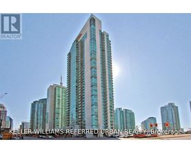 A tall building with a glass facade is the main focus of the image.