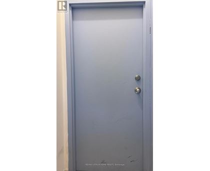 A blue door with a handle and a lock.