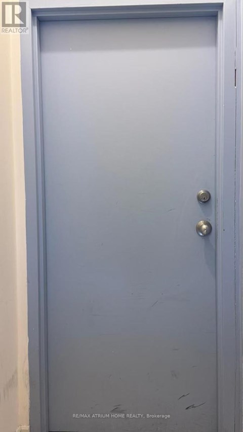A blue door with a handle and a lock.