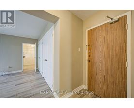 A room with a white door and a wooden door.