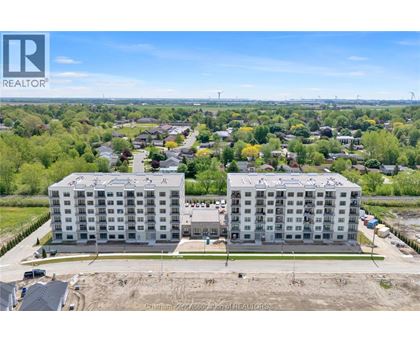 A large building with a sign that says REALTOR in the corner.