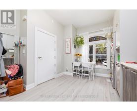 A small, white room with a table and chairs.