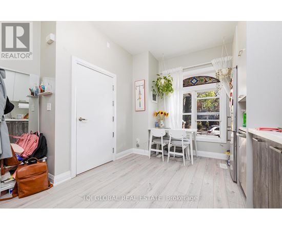 A small, white room with a table and chairs.