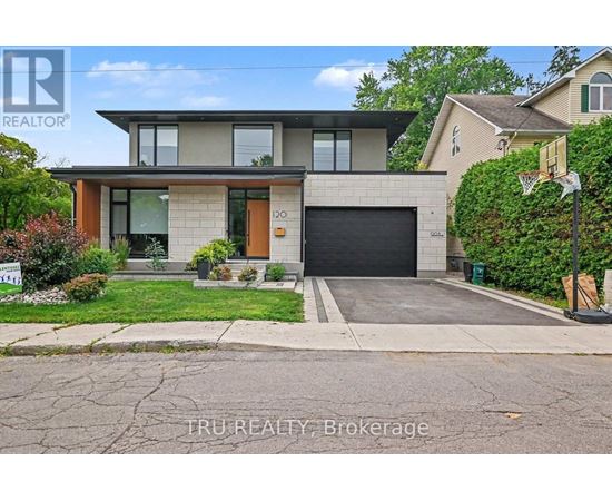 A modern house with a garage is for sale.