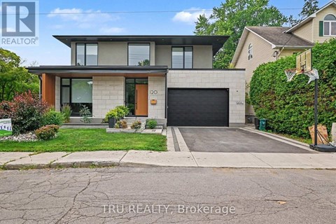 A modern house with a garage is for sale.