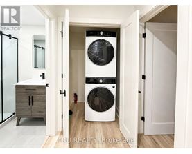 A white washer and dryer in a laundry room.