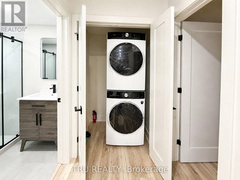 A white washer and dryer in a laundry room.