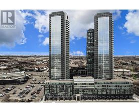 Two tall buildings with the words REALTOR and REMAX PREMIER on them.