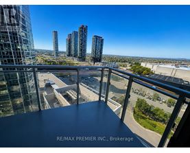 A view from a balcony overlooking a cityscape with skyscrapers.