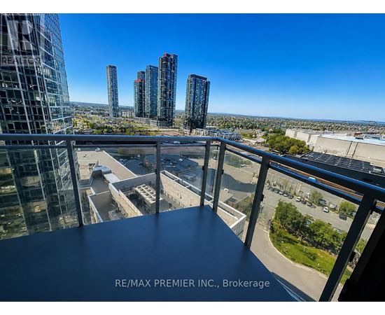 A view from a balcony overlooking a cityscape with skyscrapers.