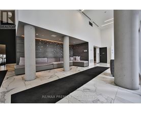 A modern living room with a black and white color scheme.