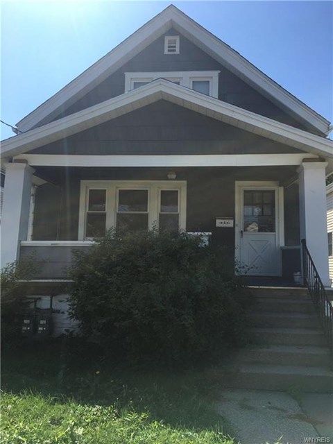 A house with a white door and windows.