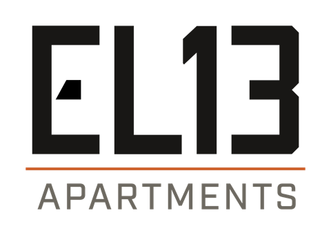 A black and white image of a sign that says "EL13 Apartments".